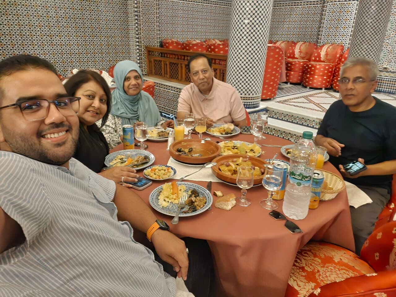 Guests sharing a generous Moroccan meal