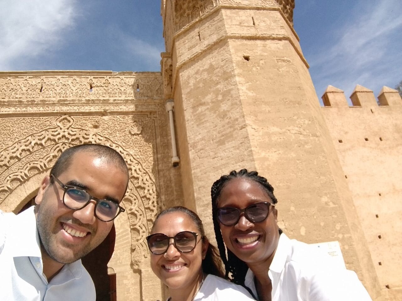 Ayoub and guests visiting a historic gate in Rabat